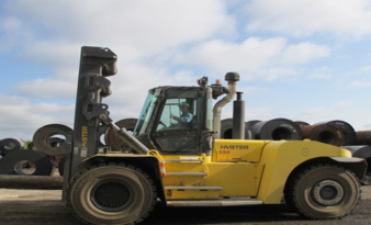 450°C COILS GET LIFTED BY 30 TONNE TRUCK WITH CHAINLESS MAST .