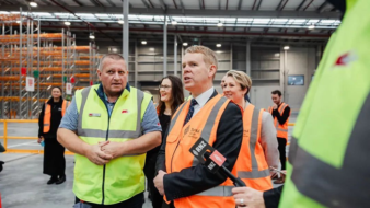 New Zealand’s PM gets to see the benefits of LiBiao Robotics parcel sorting robots up close
